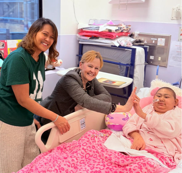 Patient in a hospital bed awaiting urgent medical transport in London arranged by a private ambulance service